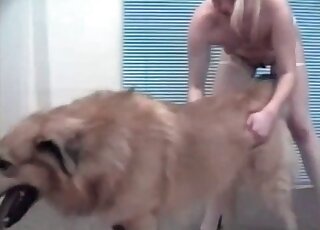 Hot blonde can't wait to start making out with her big, fluffy dog