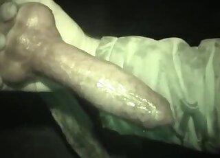 Hot dude stroking a colossal animal penis in a very hot porn vid