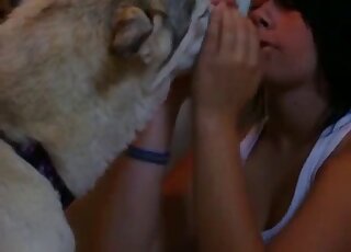 Emo girl dressed in white makes out happily with her animal here