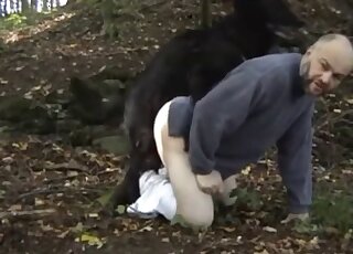 Aging zoophile fucking a black creature in the middle of the woods