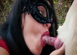 Red lipstick femme fatale seducing a sexy dog in an outdoor video