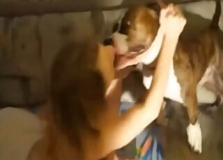 Redhead spreads legs for her dog to lick and fuck her