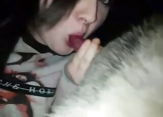 Sexy emo girl licking a dog's gorgeous penis after stroking it