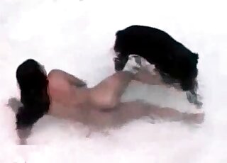 Horny brunette seduces her rottweiler to fuck her in water
