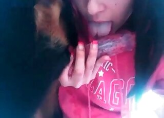 Closeup zoophilia video of a nasty slut deepthroating dog’s dick