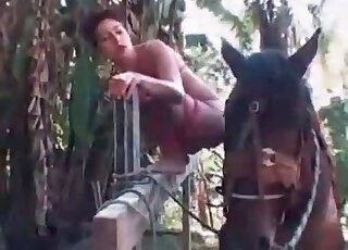 Skinny bitch seduces a horse for passionate sex outdoors