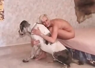Skinny blonde undresses and starts making out with a big dog at home